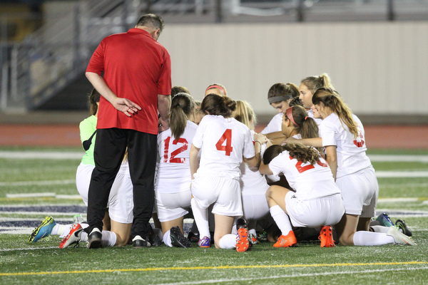 Solon, Ohio: Tuesday, Nov. 1, 2016..Cardinal Mooney players say a prayer before taking on Gilmour Academy at the Division III girls soccer regional semifinal at Stewart Field in Solon, Ohio on Tuesday, Nov. 1, 2016...(Nikos Frazier | The Vindicator