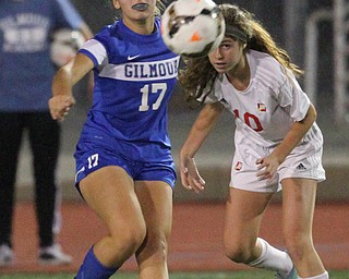 Solon, Ohio: Tuesday, Nov. 1, 2016..Gilmour's Allie Mullee(17) and Mooney's Carolyn Kay(10) watch the ball after it is kicked away after they battled over it in the first half as Cardinal Mooney High School takes on Gilmour Academy at the Division III girls soccer regional semifinal at Stewart Field in Solon, Ohio on Tuesday, Nov. 1, 2016...(Nikos Frazier | The Vindicator