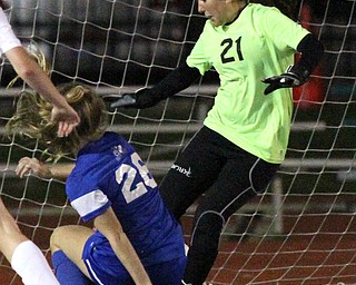 Solon, Ohio: Tuesday, Nov. 1, 2016..Gilmour's Allie Breen(26) scores a goal around Mooney goalie, Skyler Huda(21) in the second half as Cardinal Mooney High School takes on Gilmour Academy at the Division III girls soccer regional semifinal at Stewart Field in Solon, Ohio on Tuesday, Nov. 1, 2016...(Nikos Frazier | The Vindicator