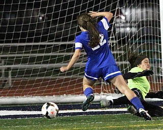 Solon, Ohio: Tuesday, Nov. 1, 2016..Gilmour's Cora Grunden(22) scores a goal around Mooney goalie, Skyler Huda(21) in the second half as Cardinal Mooney High School takes on Gilmour Academy at the Division III girls soccer regional semifinal at Stewart Field in Solon, Ohio on Tuesday, Nov. 1, 2016...(Nikos Frazier | The Vindicator