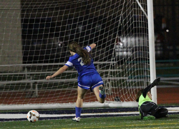 Solon, Ohio: Tuesday, Nov. 1, 2016..Gilmour's Cora Grunden(22) scores a goal around Mooney goalie, Skyler Huda(21) in the second half as Cardinal Mooney High School takes on Gilmour Academy at the Division III girls soccer regional semifinal at Stewart Field in Solon, Ohio on Tuesday, Nov. 1, 2016...(Nikos Frazier | The Vindicator