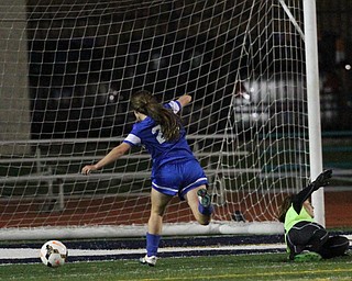 Solon, Ohio: Tuesday, Nov. 1, 2016..Gilmour's Cora Grunden(22) scores a goal around Mooney goalie, Skyler Huda(21) in the second half as Cardinal Mooney High School takes on Gilmour Academy at the Division III girls soccer regional semifinal at Stewart Field in Solon, Ohio on Tuesday, Nov. 1, 2016...(Nikos Frazier | The Vindicator
