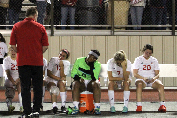 Solon, Ohio: Tuesday, Nov. 1, 2016..Mooney Head Coach, Frank Sikich talks with his players after Cardinal Mooney High School fell to Gilmour Academy, 7-1, at the Division III girls soccer regional semifinal at Stewart Field in Solon, Ohio on Tuesday, Nov. 1, 2016...(bench from right) Nicole Rotunnoi(20) Alexis Saunders(7), Trinity Adams(0), Lizzie Philibin(17)..(Nikos Frazier | The Vindicator