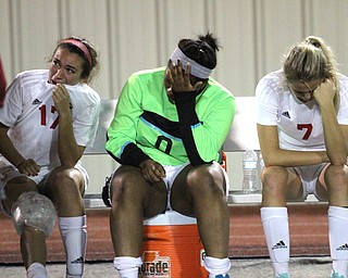 Solon, Ohio: Tuesday, Nov. 1, 2016..Mooney Head Coach, Frank Sikich talks with his players after Cardinal Mooney High School fell to Gilmour Academy, 7-1, at the Division III girls soccer regional semifinal at Stewart Field in Solon, Ohio on Tuesday, Nov. 1, 2016...(bench from right)Alexis Saunders(7), Trinity Adams(0), Lizzie Philibin(17)..(Nikos Frazier | The Vindicator