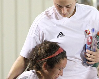 Solon, Ohio: Tuesday, Nov. 1, 2016..Mooney's Lizzie Philibin(17) is consoled by teammate, Caitlin Perry(9) after Cardinal Mooney High School fell to Gilmour Academy, 7-1, at the Division III girls soccer regional semifinal at Stewart Field in Solon, Ohio on Tuesday, Nov. 1, 2016..(Nikos Frazier | The Vindicator