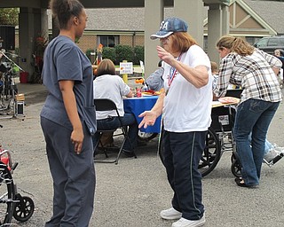 Neighbors | Alexis Bartolomucci.Beeghly Oaks resident, Esther Woodruff, danced with one of the faculty members at the first annual car show at Beeghly Oaks on Oct. 1.