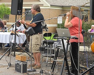Neighbors | Alexis Bartolomucci.Take II band consisting of Robert "Dr. Bob" and Ellie Walton played at the first annual car cruise at Beeghly Oaks on Oct. 1.