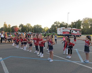 Neighbors | Alexis Bartolomucci.The Austintown Little Falcon cheerleaders put on a performance during the pep rally on Oct. 6 for the families who attended.