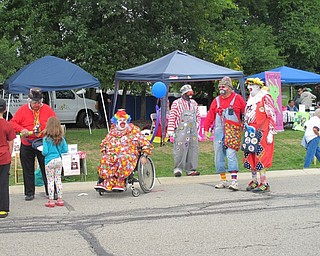 Neighbors | Alexis Bartolomucci.Clowns at Oktoberfest at Boardman Park on Oct. 2 made balloon animals and entertained the families who attended the event.