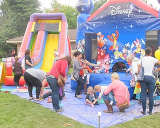 Neighbors | Alexis Bartolomucci.There were bounce-a-rounds and slides for the children to play on during Oktoberfest at Boardman Park on Oct. 2.