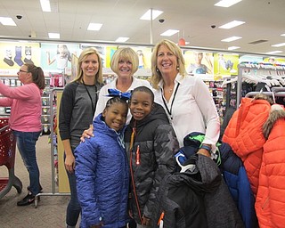 Neighbors | Alexis Bartolomucci.Members from the Boardman Lions Club stood with two children who came to pick out coats on Oct. 4 at Target. Pictured are, from left, (front) Ari'Ana and Elijah; (back) Jana Coffin, Kathy Collins and Joni Blase.