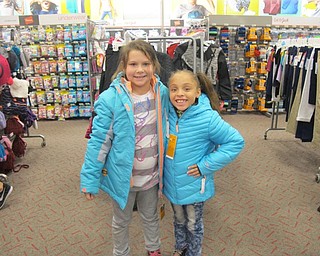Neighbors | Alexis Bartolomucci.Joie Lynne Beebout and Tavia Williams tried on the new coats they picked out at Target during the Boardman Lions Club Coats for Kids project on Oct. 4.