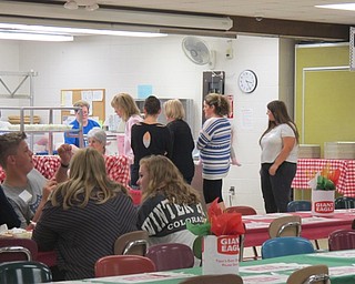 Neighbors | Alexis Bartolomucci.Guests lined up to get their pasta at Poland Seminary High School during the pasta dinner event on Oct. 2 for the PSHS band.
