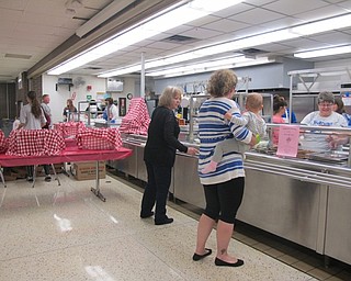 Neighbors | Alexis Bartolomucci.Band parents and volunteers helped serve pasta to the guests at the pasta dinner at Poland Seminary High School on Oct. 2.