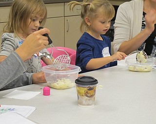 Neighbors | Alexis Bartolomucci.Valentina and Aurora mashed their potatoes during Sprout Club on Oct 13 at Fellows Riverside Gardens.