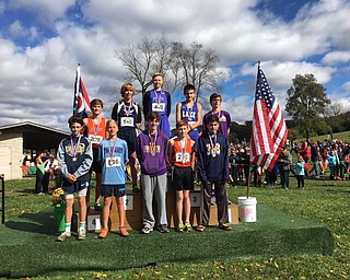 Neighbors | Submitted.Mason Matiste posed on the first place podium after beating out all 568 runners in the championship meet.