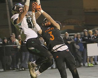  .          ROBERT  K. YOSAY | THE VINDICATOR..Springfield Tigers vs Columbia Raiders..#81 Columia  Lance Boise jumps a bit higher to score a TD as #3 Brandon Walters  tries to defend..-30-