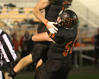  .          ROBERT  K. YOSAY | THE VINDICATOR..Springfield Tigers vs Columbia Raiders.#19 for Springfield   Ethan Nezbeth is lifted to the air after a score by #58 Zachary Renaldy after second quarter action..-30-