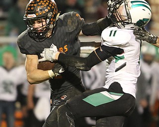  .          ROBERT  K. YOSAY | THE VINDICATOR..Springfield Tigers vs Columbia Raiders..Stiff running as Springfield #2 Frankie Centofanti stiff arms  #11  Jared Heidecker  as he goes for a first down during second quarter action.-30-