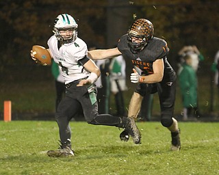  .          ROBERT  K. YOSAY | THE VINDICATOR..Springfield Tigers vs Columbia Raiders..Hot Pursuit as Springfields #19 Ethan Nezbeth as he chases down  Cody Schwatz QB for a loss during second quarter action.-30-