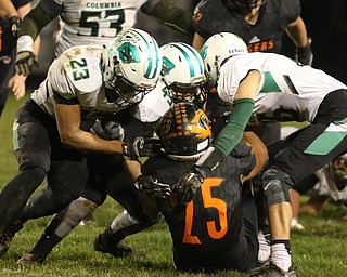  .          ROBERT  K. YOSAY | THE VINDICATOR..Springfield Tigers vs Columbia Raiders..Springfield #25Luke Snyder is coralled by  Columbia #23 Brandon Coleman 16 Jared Bycznski and 45 Adam Alten as  he stopped after  a short gain.-30-