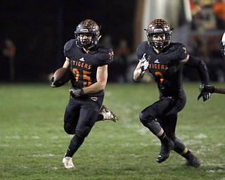  .          ROBERT  K. YOSAY | THE VINDICATOR..Springfield Tigers vs Columbia Raiders..Springfields #25 Luke Snyder takes off around end and #2 Frankie Centofanti  takes off around end during first quarter action.-30-