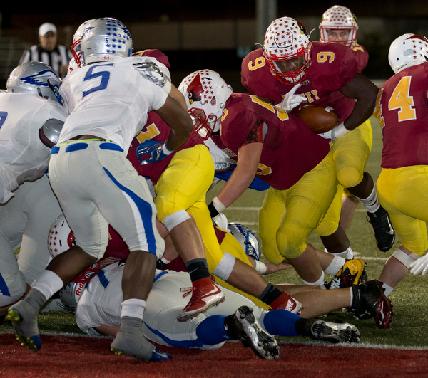 MICHAEL G TAYLOR | THE VINDICATOR- 11-04-16- 2nd qtr, Mooney's #9 Jaylen Hewlett scores 1 yard rushing TD to tie the game. OHSAA D4 Football Playoffs Hubbard Eagles vs Cardinal Mooney Cardinals at Stambaugh Stadium, YSU in Youngstown, OH