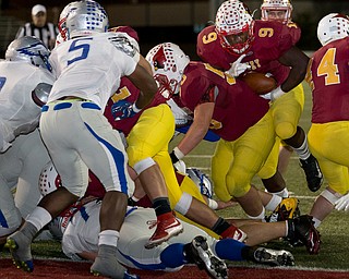 MICHAEL G TAYLOR | THE VINDICATOR- 11-04-16- 2nd qtr, Mooney's #9 Jaylen Hewlett scores 1 yard rushing TD to tie the game. OHSAA D4 Football Playoffs Hubbard Eagles vs Cardinal Mooney Cardinals at Stambaugh Stadium, YSU in Youngstown, OH