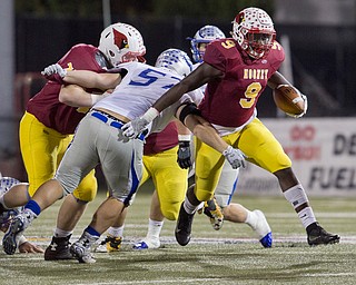 MICHAEL G TAYLOR | THE VINDICATOR- 11-04-16- 1st qtr, Mooney's #9 Jaylen Hewlett breaks the tackle of Hubbard's #57 Salvatore Pesce to pickup the 1st down.. OHSAA D4 Football Playoffs Hubbard Eagles vs Cardinal Mooney Cardinals at Stambaugh Stadium, YSU in Youngstown, OH