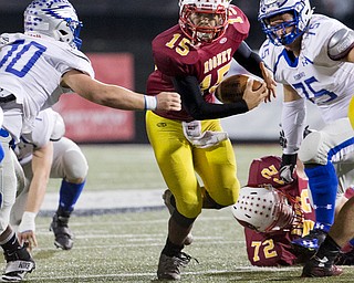 MICHAEL G TAYLOR | THE VINDICATOR- 11-04-16- 1st qtr, Mooney's #15Antonio Page runs through the hole to pickup the 1st down.. OHSAA D4 Football Playoffs Hubbard Eagles vs Cardinal Mooney Cardinals at Stambaugh Stadium, YSU in Youngstown, OH