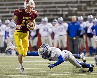 MICHAEL G TAYLOR | THE VINDICATOR- 11-04-16- 3rd qtr, Mooney's #10 Pat Pelini runs by the diving tackle attempt of Hubbard's 6 Joe Fisher. OHSAA D4 Football Playoffs Hubbard Eagles vs Cardinal Mooney Cardinals at Stambaugh Stadium, YSU in Youngstown, OH