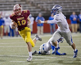 MICHAEL G TAYLOR | THE VINDICATOR- 11-04-16- 4th qtr, Mooney's #10 Pat Pelini runs by Hubbard's #18 Ryan Halavick on his way to a 23 yards TD. OHSAA D4 Football Playoffs Hubbard Eagles vs Cardinal Mooney Cardinals at Stambaugh Stadium, YSU in Youngstown, OH