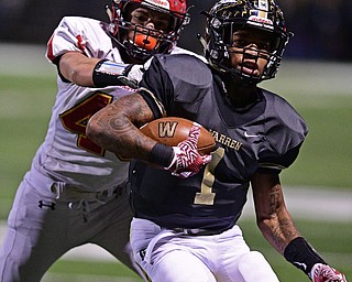 WARREN, OHIO - NOVEMBER 4, 2016: Lynn Bowden #1 of Harding is forced out of bounds by Michael Graham #49 of Brecksville-Broadview Heights during the first half of their game Friday night at Warren Harding High School. DAVID DERMER | THE VINDICATOR