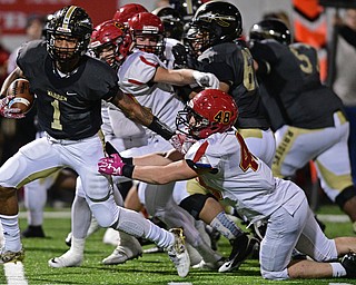 WARREN, OHIO - NOVEMBER 4, 2016: Lynn Bowden #1 of Harding slips away from Jack O'Donnell #48 of Brecksville-Broadview Heights on his way to scoring a touchdown during the first half of their game Friday night at Warren Harding High School. DAVID DERMER | THE VINDICATOR