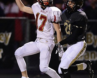 WARREN, OHIO - NOVEMBER 4, 2016: Sam Wiglusz #17 of Brecksville-Broadview Heights celebrates after scoring a touchdown beating Troy Jakubec #21 of Harding during the second half of their game Friday night at Warren Harding High School. DAVID DERMER | THE VINDICATOR