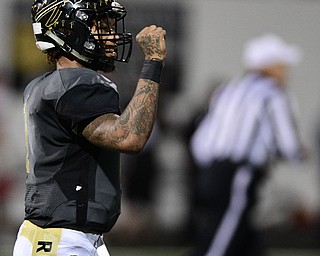 WARREN, OHIO - NOVEMBER 4, 2016: Lynn Bowden #1 of Harding pumps his fist after Kayron Adams #33 broke off a touchdown run during the second half of their game Friday night at Warren Harding High School. DAVID DERMER | THE VINDICATOR