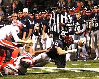 Nikos Frazier | The Vindicator..JFK's Jacob Coates(44) stretches out after being taken down by Toronto's Max Tice(34) in the first quarter during an OSHAA Division VII Playoff game between Toronto and John F. Kennedy Catholic High School in Warren at Mollenkopf Stadium in Warren on Saturday, Nov. 5, 2016.