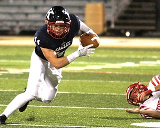 Nikos Frazier | The Vindicator..JFK's Jacob Coates(44) rushes forward after dodging Toronto's Danny Zdinak(20) in the first quarter during an OSHAA Division VII Playoff game between Toronto and John F. Kennedy Catholic High School in Warren at Mollenkopf Stadium in Warren on Saturday, Nov. 5, 2016.