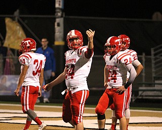 Nikos Frazier | The Vindicator..A Toronto player challenges the JFK Student Section while being taunted in the second quarter during an OSHAA Division VII Playoff game between Toronto and John F. Kennedy Catholic High School in Warren at Mollenkopf Stadium in Warren on Saturday, Nov. 5, 2016.