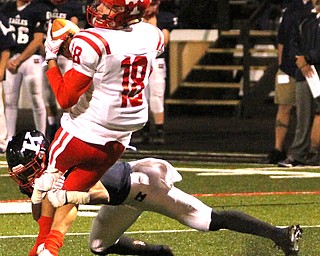 Nikos Frazier | The Vindicator..Toronto's Jake Keenan(18) is brought down by JFK's Danny Mccartney(8) in the second quarter during an OSHAA Division VII Playoff game between Toronto and John F. Kennedy Catholic High School in Warren at Mollenkopf Stadium in Warren on Saturday, Nov. 5, 2016.