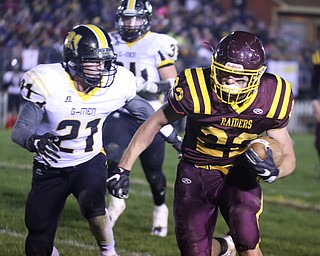             ROBERT  K. YOSAY | THE VINDICATOR..Third quarter as SR #22 Ethan Dominguez  outruns GMEN #21 Seth Morgan as he set up SR  second TD..James A Garfield - G-Men  vs South Range Raiders at South Range Stadium..-30-