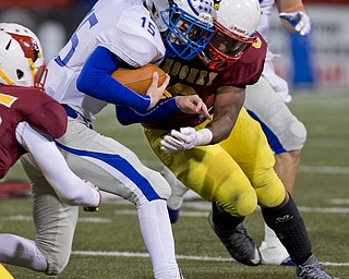 MICHAEL G TAYLOR | THE VINDICATOR- 11-04-16- 3rd qtr, Hubbard's #15 Jamie Thomson is hit hard by Mooney's #8 Ray Anderson. OHSAA D4 Football Playoffs Hubbard Eagles vs Cardinal Mooney Cardinals at Stambaugh Stadium, YSU in Youngstown, OH