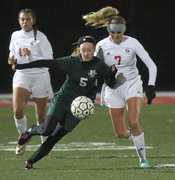 William D. Lewis the Vindicator  Ursuline's Abby Price(5) and Mooney's Alexa Saunders(7) go for the ball during 10272016 action at Girard.