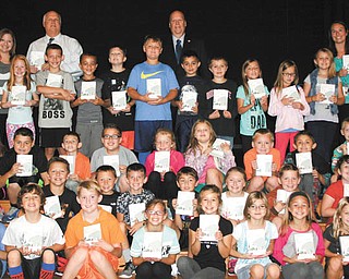 SPECIAL TO THE VINDICATOR
The Berlin-Ellsworth Ruritan recently donated dictionaries to third-grade students at Western Reserve Local School. The club hopes that the dictionaries will allow the students to develop a strong vocabulary and succeed in the upcoming Third Grade Reading Guarantee exam. In the back from left, behind the third-grade class, are Brittney Rothbauer, teacher; Doug McGlynn, superintendent and club member; Denny Furman, Western Reserve Township trustee and club member; and Gina Alexander, teacher.