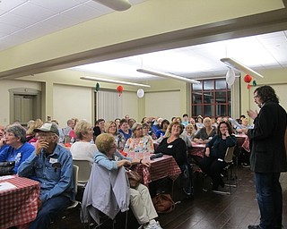 Neighbors | Alexis Bartolomucci.Bo Jalais, played by Rob Morris, confessed the truth to the audience after they guessed who the murderer was during the Murder in the Library event at the Boardman library on Sept. 29.