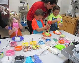 Neighbors | Alexis Bartolomucci.Children decorated their sugar skulls at the Sugar Showcase's edible activity day on Oct. 15.