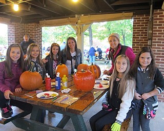 Neighbors | Alexis Bartolomucci.Friends attended the pumpkin carving competition at Boardman Park on Oct. 14-16 to carve their own pumpkins to enter in the competition.