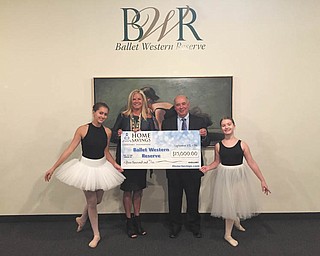 SPECIAL TO THE VINDICATOR
Home Savings Charitable Foundation recently donated $15,000 to Ballet Western Reserve, a pre-professional and recreational dance studio that offers classical ballet, modern and other styles of dance instruction. The donation will enable BWR to implement a new broad-based marketing plan that includes website construction and enhanced social media presence on multiple platforms. BWR will perform “The Wizard of Oz” Nov. 18 and 19 in Powers Auditorium in Youngstown. For information on the studio, call 330-744-1934 or visit www.balletwesternreserve.org. Sabrina Shapiro, executive director of BWR, helps hold an oversize check with Frank Heirro, Home Savings Mahoning Valley Regional president. With them are dancers Ava Shapiro, left, and Alexandra Popovich.

