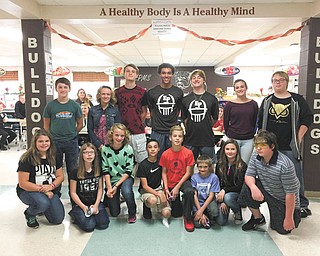 SPECIAL TO THE VINDICATOR
East Palestine Middle School fifth- and sixth-graders participated in the positive role model luncheon “Bulldog Pride is Something to Bark About” on Oct. 21. To be selected for the program, students completed a form to nominate their high school role model of choice including reasons why they chose that student, how they can learn from that student and how they can be role models to others. The school hosts three role model events throughout the year. The high school students selected to participate are unique in their abilities and activities, with nominations including student-athletes, band members, cheerleaders and motocross competitors. Middle school students participating in the event, in front from left, are Jordan Adams, Harleigh Bishop, Hannah Cunningham, Weston Jones, Ryan Rosen, Sam Harding, Laredo Cienik and Richard Puckett. High school students chosen for this event, in back, are Jared Lambright, Alexis Cunningham, Andy Cunningham, Dominic Posey, Parker Sherry, Blair Nulf and Seth McLaughlin.