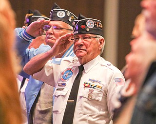        ROBERT K. YOSAY  | THE VINDICATOR..Lloyd Gruver and Zeno Both of Austintown and Both army vets    salute as the flag is presented..Foley 33rd Veterans Day Program as Junior and Seniors gathered in the Auditorium to honor those that served our country .. - -30-...